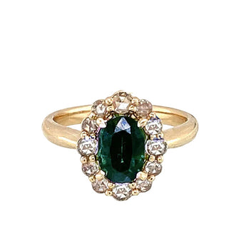 yellow gold ring with a green sapphire and rose cut diamond halo engagement ring