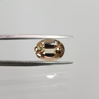4.66 carat oval-cut pink-yellow topaz loose gemstone