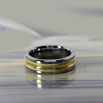 7mm grey tungsten and 10 karat yellow gold ring with double milgrain inlay by madani