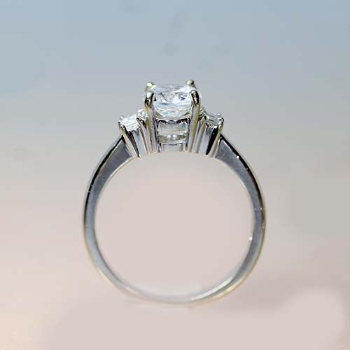 18 karat white gold & three stone diamond engagement ring, centre stone not included