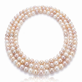 A multi-strand pearl necklace composed of round, lustrous pearls in soft champagne, blush, and cream tones.