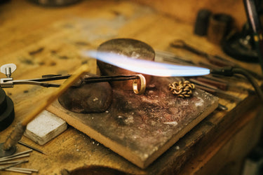 Goldsmith performing jewelry repair and restoration at True Bijoux atelier in Ottawa