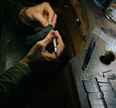 Goldsmith performing jewelry repair and restoration at True Bijoux atelier in Ottawa