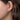Gabriel & Co. 14K White Gold 10mm Diamond Classic Huggies on a woman's ear