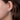 Gabriel & Co. 14K White Gold Twisted Huggies on woman's ear