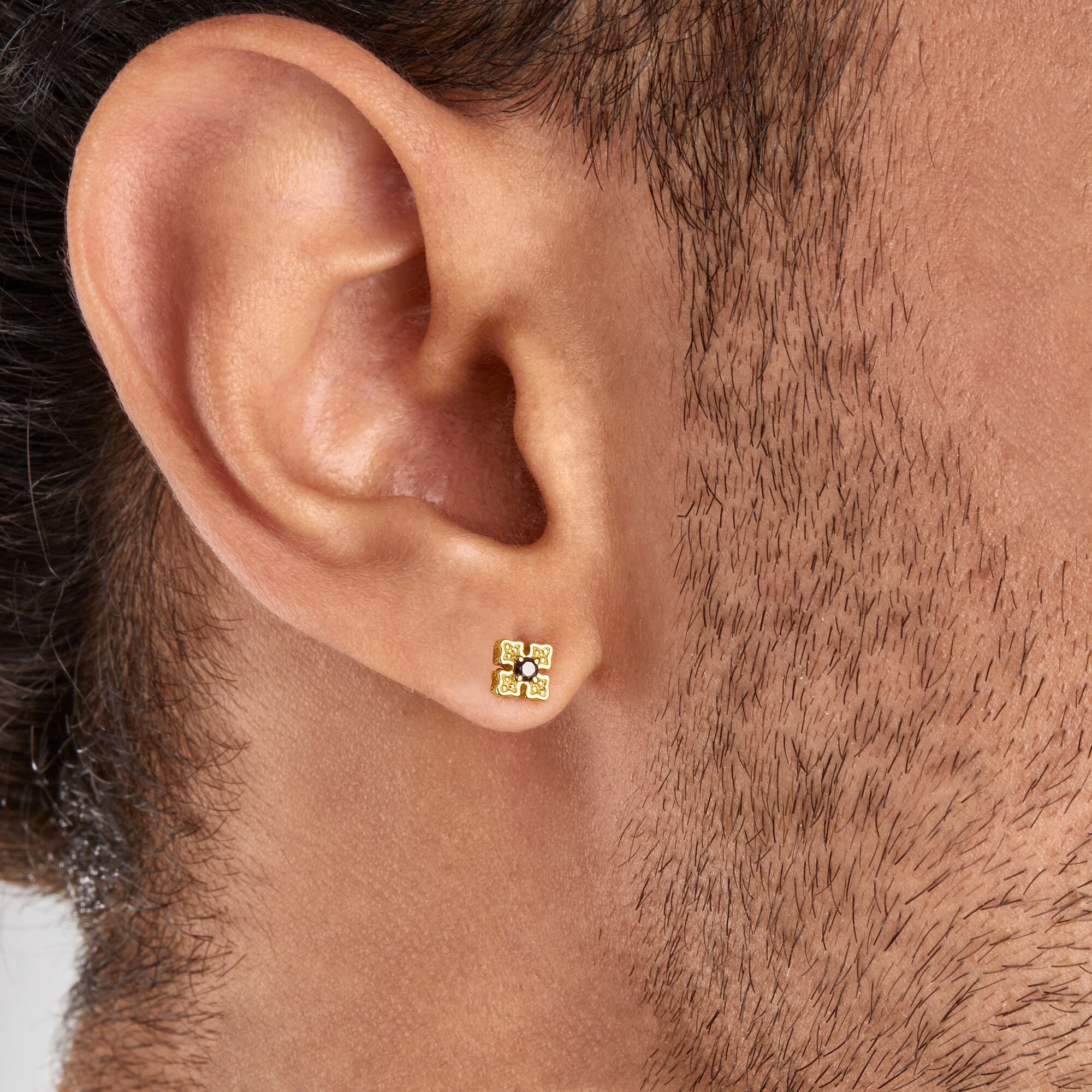 Thomas Sabo 18k Gold Plated Royalty Ear Studs on a man's ear