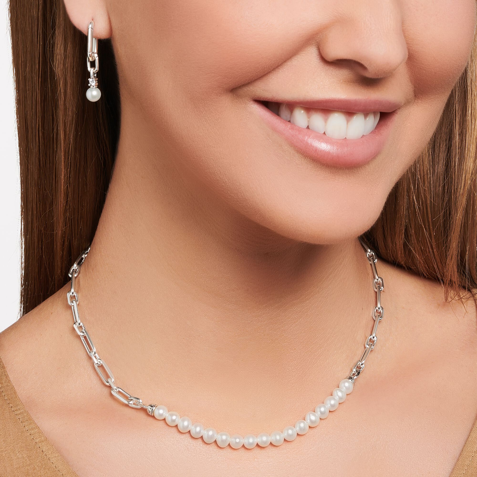 Thomas Sabo Sterling Silver Chain Links and Pearl Necklace worn by a woman with matching earrings