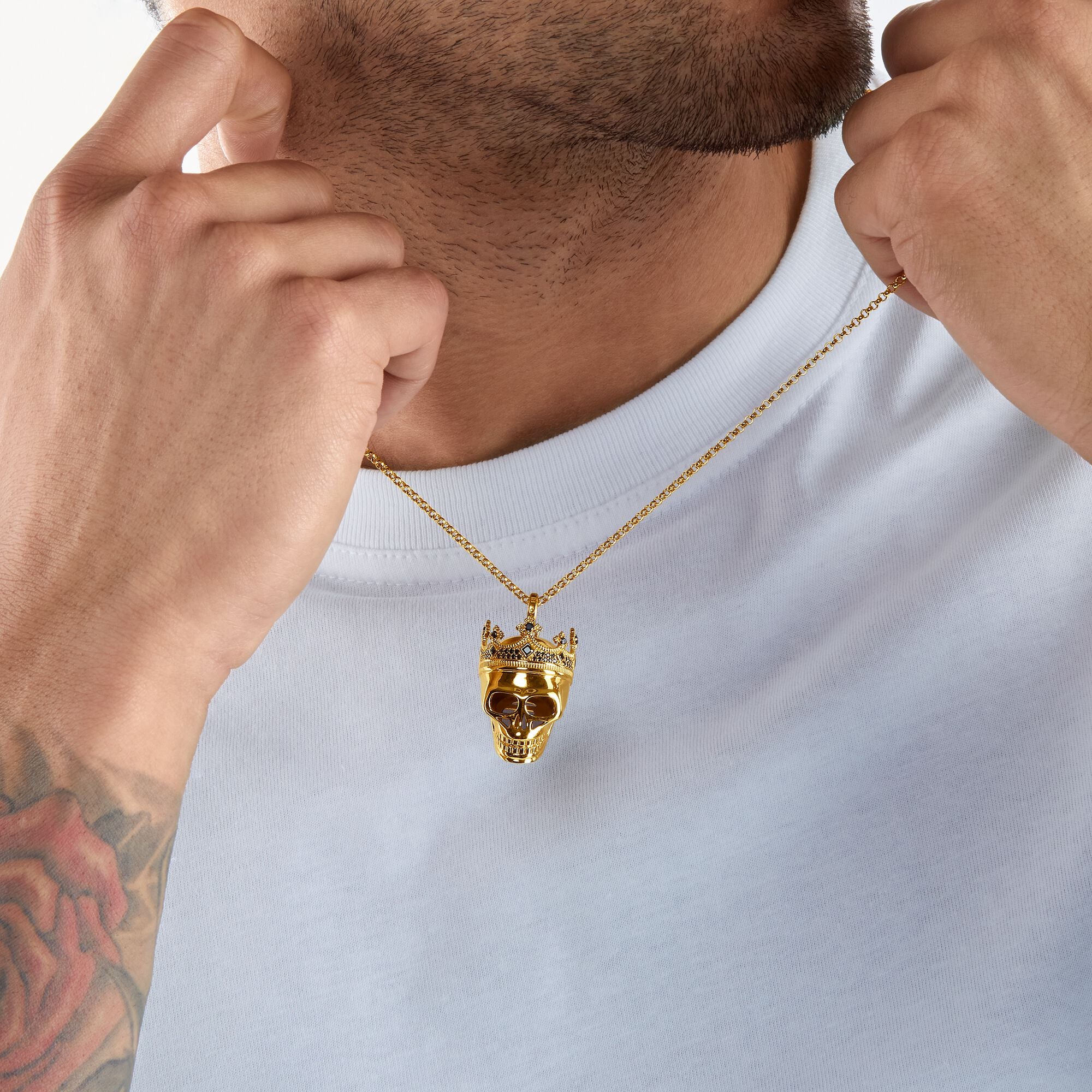 Thomas Sabo 18k Yellow Gold Plating Skull King Pendant on a chain around a man's neck