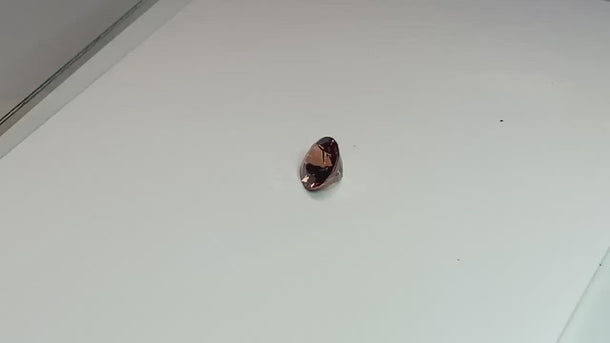 2.63 carat oval cut orange-purple loose sapphire gemstone